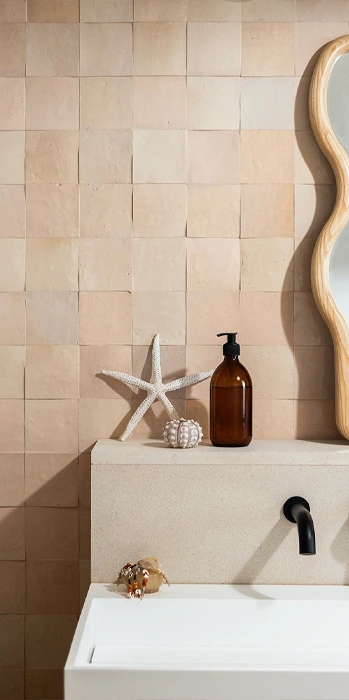 Nude zellige tiles on bathroom wall